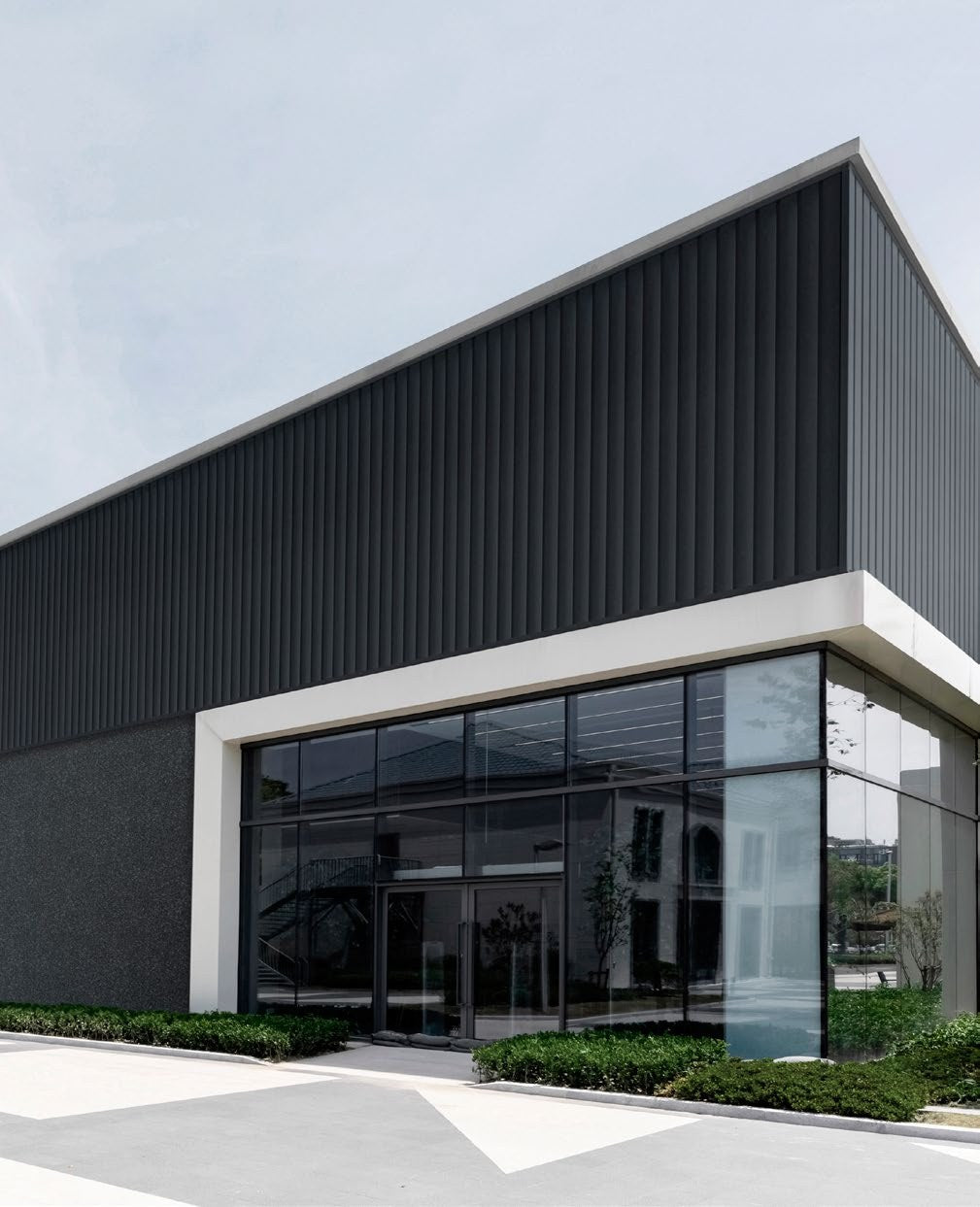 Budmat Fassadenlamellen Referenz – hinterlüftete Fassade in Dekor-Optik