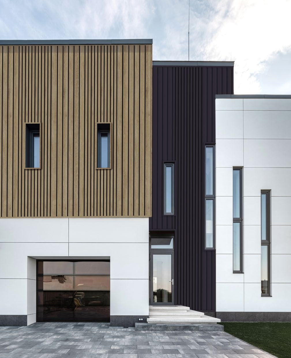 Budmat Fassadenlamellen Referenz – hinterlüftete Fassade in Dekor-Optik