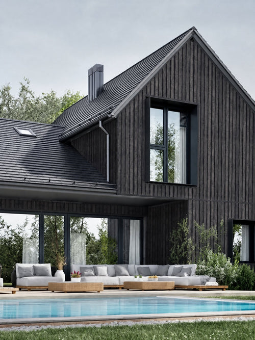 Modernes Haus mit dunkler Metallfassade in Holzoptik und anthrazitfarbenem Dach