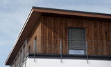 Budmat Fassadenlamellen Referenz – hinterlüftete Fassade in Dekor-Optik